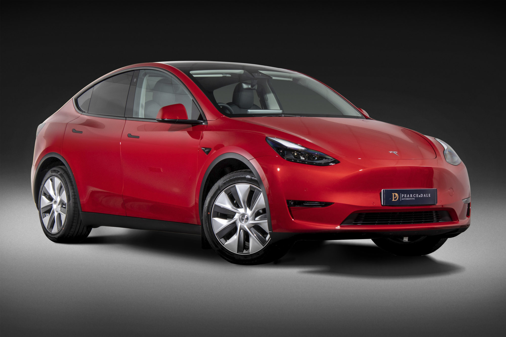 Tesla Model Y Red black background Pearce & Dale